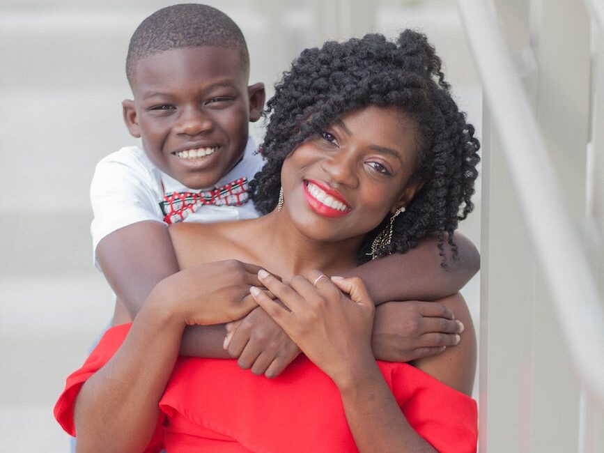 photo of boy hugging his mom